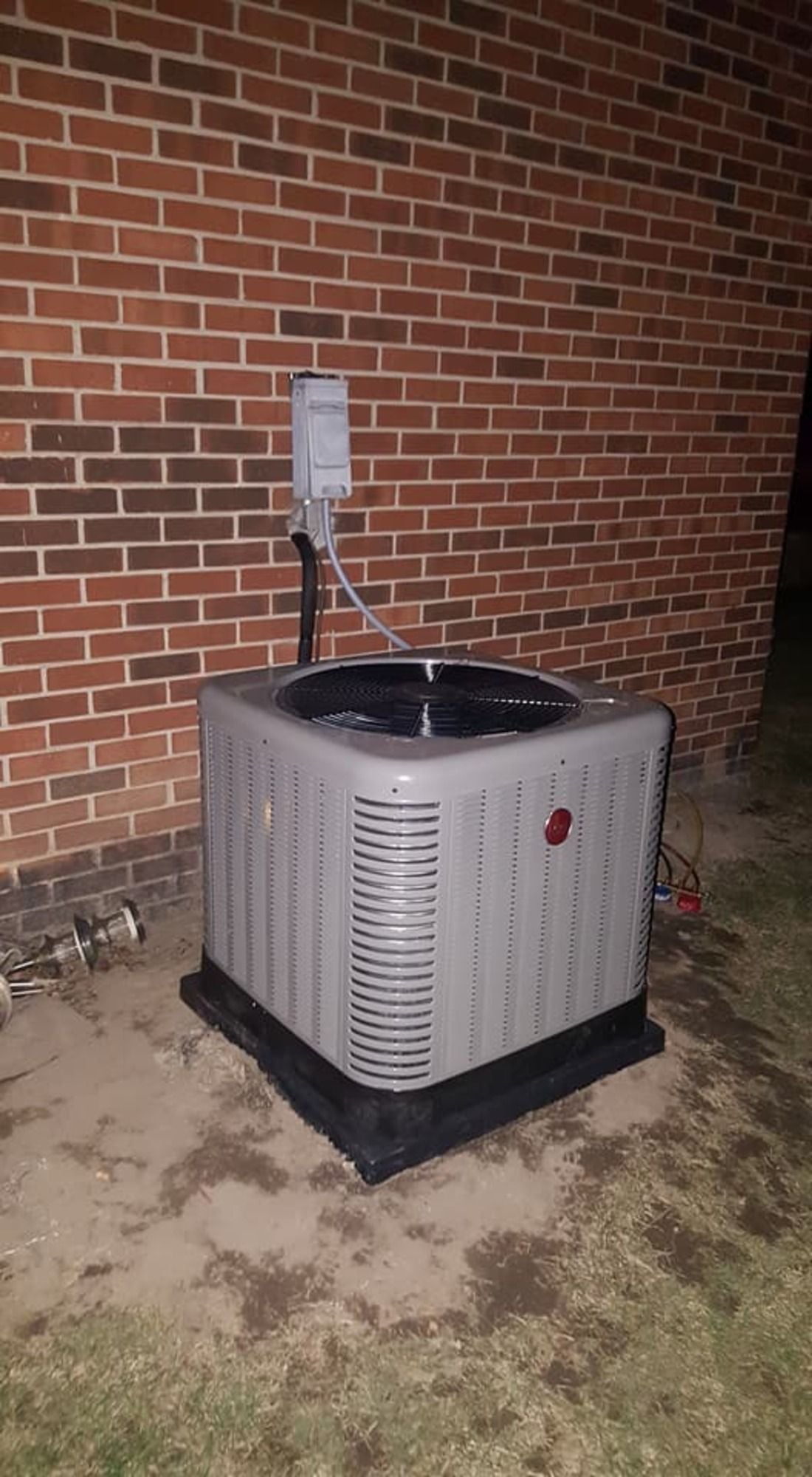 Completed outdoor air conditioning condenser installation