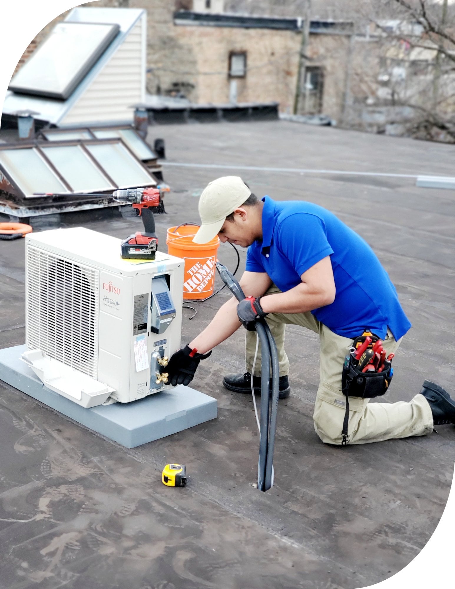 Direct Improvements technician servicing a rooftop cooling unit