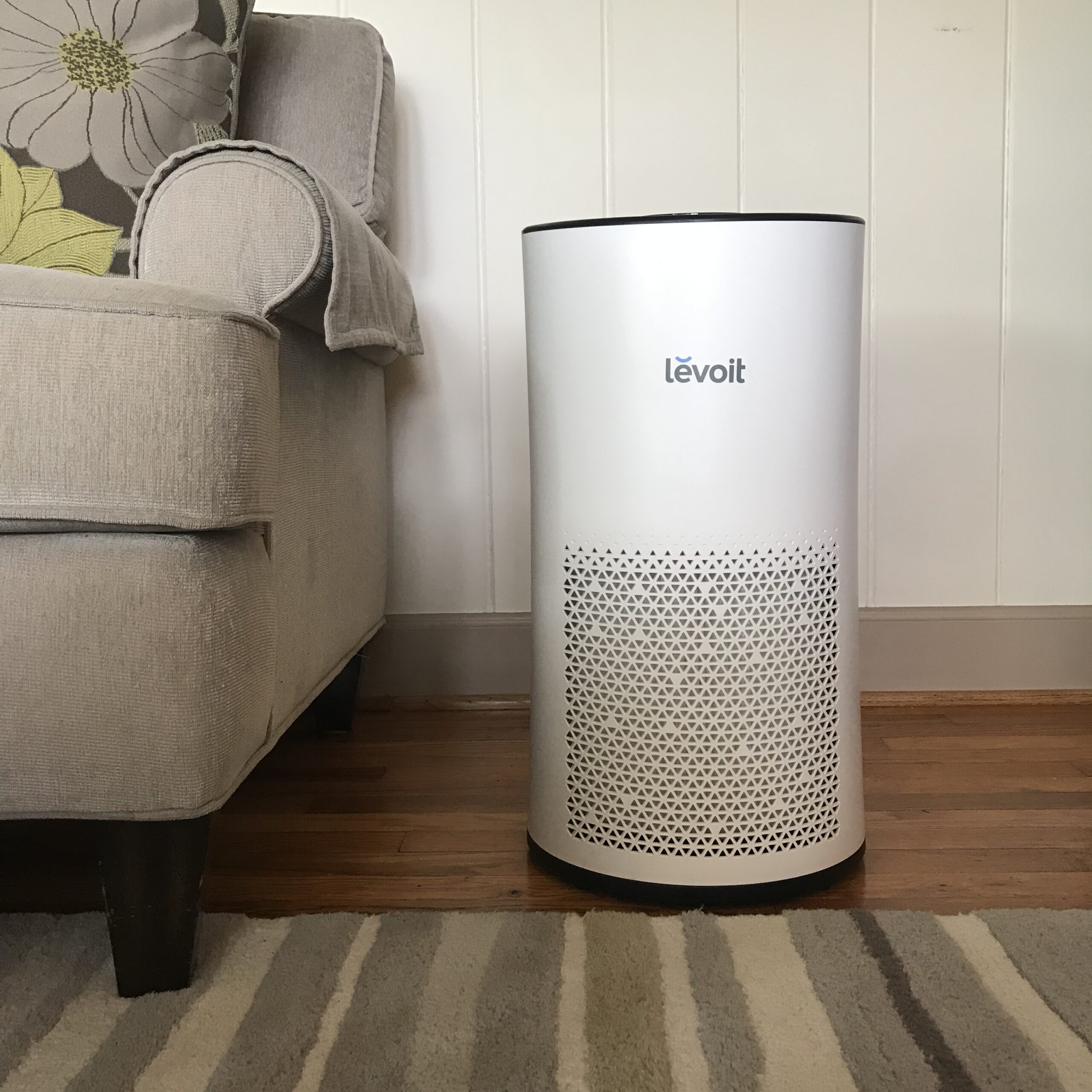 Home air purifier in a living room — indoor air quality service