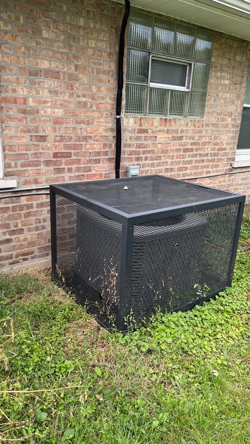 Outdoor AC condenser in the backyard